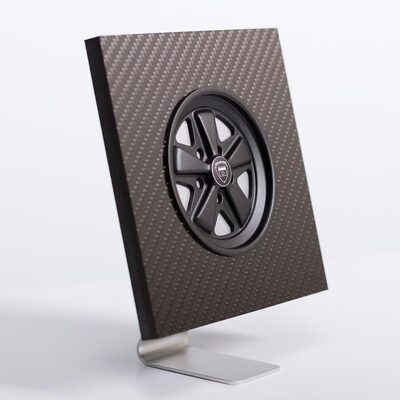 Black Fuchs inspired wheel in a carbon fibre display stand